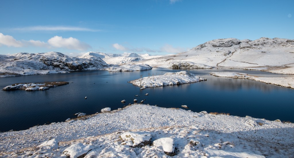 Helvellyn massif viewed across Angle Tarn
