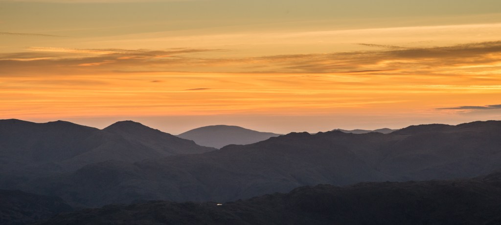 Looking westwards to the setting sun from the Helvellyn ridge
